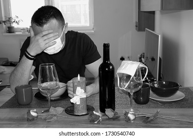 Alone Despairing Man Sitting Near Arranged Table For Romantic Dinner And Waiting For Date Partner. Failed Date With One Person. Boy Wearing Fask Mask To Protect From Coronavirus.