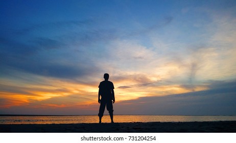 alone man sunset