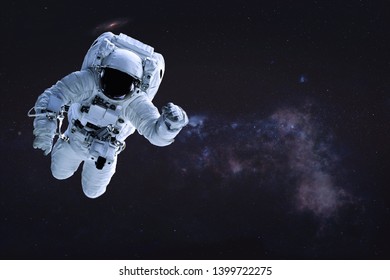 Alone single Astronaut in outer space. Science fiction wallpaper. Elements of this image were furnished by NASA. - Powered by Shutterstock