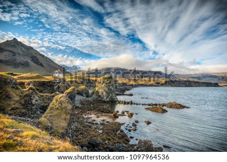Alone standing house in fishing village of Arnarstapi in Iceland. Panoramic view