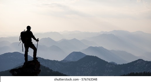 alone at the summit climber & successful climbers - Shutterstock ID 576763348
