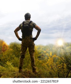 Alone Tired Young USA Nato Male Guy Stand Rest Hand Hip Waist Look Hope Protect Danger Forest Tree Light White Sky Text Space. Lone Sad Worry Feel Upset Lost Vet Medic Hero God Faith Worship Concept