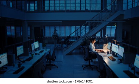 Alone Working Late at Night in the Office: Businesswoman Using Desktop Computer, Analyzing, Using Documents, Solving Problems, Finishing Project - Shutterstock ID 1786141001