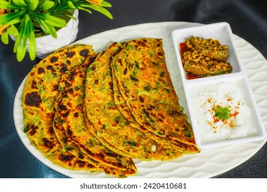 Aloo paratha or methi paratha also known as Potato or pyaz stuffed flatbread dish originating from the Indian subcontinent.