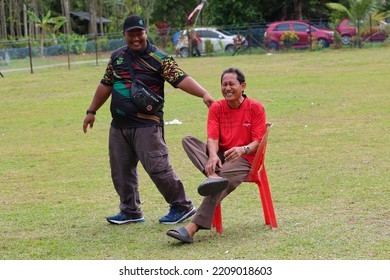 Alor Setar, Kedah, Malaysia - September 20th, 2022 : Group Of People  Men, Women And Kid  Playing Musical Chair Game