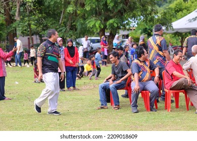 Alor Setar, Kedah, Malaysia - September 20th, 2022 : Group Of People  Men, Women And Kid  Playing Musical Chair Game