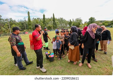 Alor Setar, Kedah, Malaysia - September 20th, 2022 : Group Of People  Men, Women And Kid  Playing Musical Chair Game