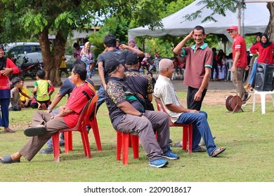 Alor Setar, Kedah, Malaysia - September 20th, 2022 : Group Of People  Men, Women And Kid  Playing Musical Chair Game