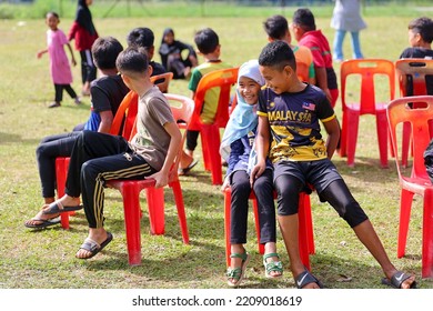 Alor Setar, Kedah, Malaysia - September 20th, 2022 : Group Of People  Men, Women And Kid  Playing Musical Chair Game