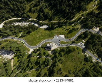 Alp Adventure Road Hair Pin Twisty In The Dolomites, Italy. Aerial Drone Overview. Driving Route Rally Cars And Traffic Passing Over A Mountain Range. Overhead.