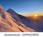 Alpenglow during a winter sunset in the mountains of British Columbia, Canada