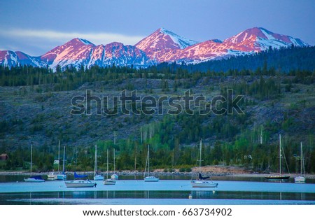 Alpenglow hitting the peaks of Grays and Torreys beyond the Frisco Bay Marina in Frisco, Colorado.