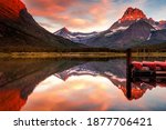 Alpenglow on Mount Grinnell at dawn seen at Many Glacier in Montana