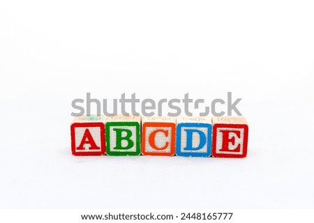 Alphabet ABCDE blocks isolated on white background.