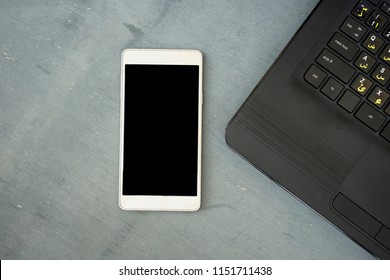 alphabet English and Arabic font on keyboard with mobile phone in blank screen. with copy space from above  - Powered by Shutterstock