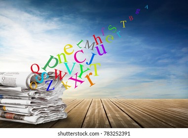 alphabet with journal on sky background - Shutterstock ID 783252391