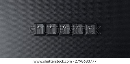 Alphabet Learning Concept With ABCDE Keyboard Keys On Dark Background