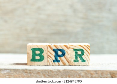 Alphabet Letter Block In Word BPR (Abbreviation Of Business Process Reengineering Or Batch Processing Record) On Wood Background