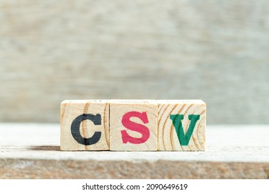 Alphabet Letter Block In Word CSV (Abbreviation Of Computer System Validation Or Comma-separated Values) On Wood Background