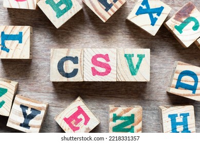 Alphabet Letter Block In Word CSV (Abbreviation Of Computer System Validation Or Comma-separated Values) And Another Letter On Wood Background