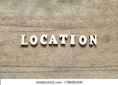 Alphabet Letter Block In Word Location On Wood Background