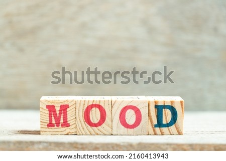 Alphabet letter block in word mood on wood background