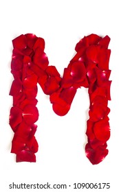 Alphabet letter M made from red petals rose isolated on a white background