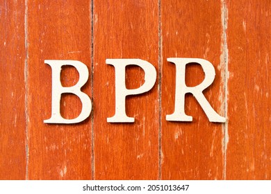 Alphabet Letter In Word BPR (Abbreviation Of Business Process Reengineering Or Batch Processing Record) On Old Red Color Wood Plate Background