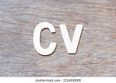 Alphabet Letter In Word CV (Abbreviation Of Curriculum Vitae) On Wood Background