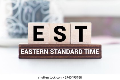 Alphabet Letter In Word EST Abbreviation Of Established, Estimated, Eastern Time Zone, Expressed Sequence Tag On Wood Background