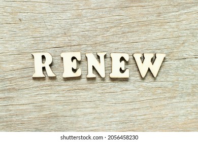 Alphabet letter in word renew on wood background