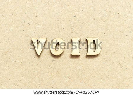 Alphabet letter in word void on wood background