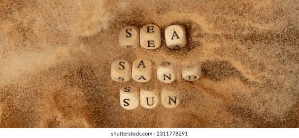 Alphabet letter wording "Sea Sand Sun" bead toy flying over explosion flying in air. Sea Sand Sun word alphabet letter show tropical island beach sand for vacation holiday. Top view action - Shutterstock ID 2311778291