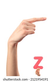 Alphabet - letter Z spelling by woman's hand in American Sign Language (ASL) on white background
