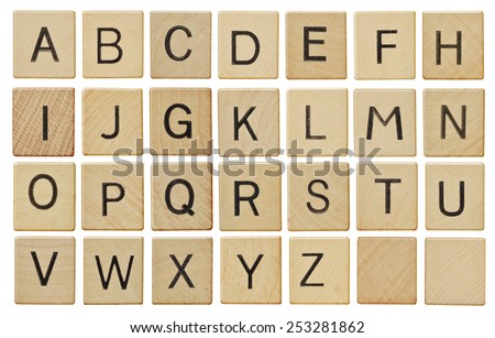 Alphabet letters on wooden letter pieces, isolated on white.