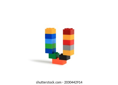 Alphabet letters U from colorful plastic brick block constructor isolated on white background. Image with Clipping path
