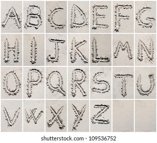 Alphabet letters writing on the sand beach