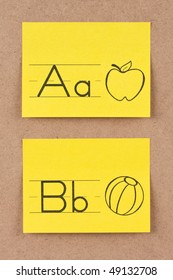 Alphabet notes on corkboard. Concept of learning.
