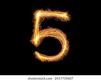 Alphabet and Number five sparklers on black background by light painting.number 5 sparkling golden for party and Celebrate.