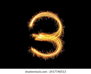Alphabet and Number three sparklers on black background by light painting.number 3 sparkling golden for party and Celebrate.