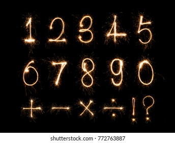 Alphabet And Numbers Sparklers On Black Background