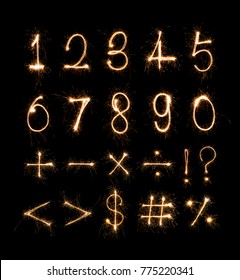 Alphabet And Numbers Sparklers On Black Background