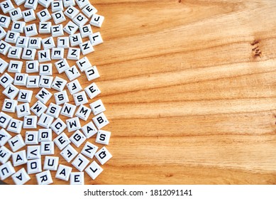 Alphabets concept random on a wooden background