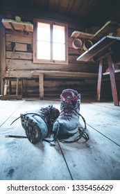 Alpine boots inside of a rustic mountain chalet, Austria