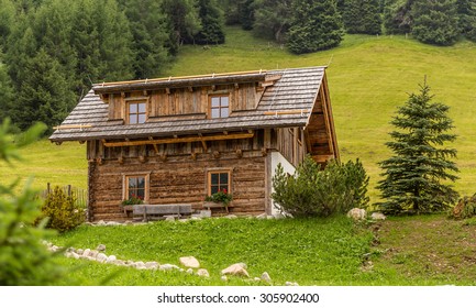 Alpine Chalet In Mountains On Summer