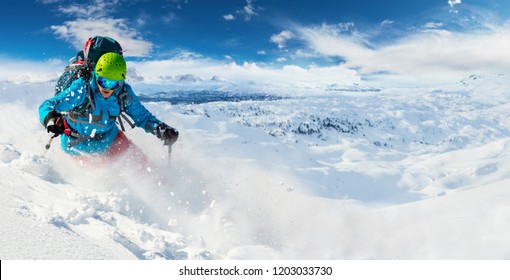 Alpine Freeride Skier Skiing Downhill With Powder Snow Explosion. Winter Sports And Leasure Activities