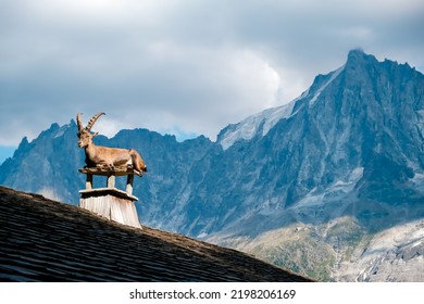Alpine ibex, goats with long horns, perch on the roofs of housesºº - Shutterstock ID 2198206169