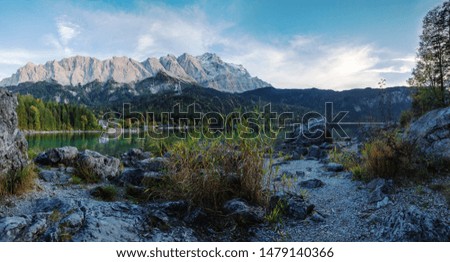alpine lake eibsee and mountain range with the highest bavarian peak zugspitze, landscape  in the evening