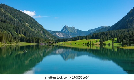 Alpine Lake In An Environment Of Mountains And The Woods