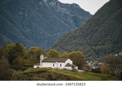 Alpine lakeside town with snow-capped mountains and serene waters - Powered by Shutterstock